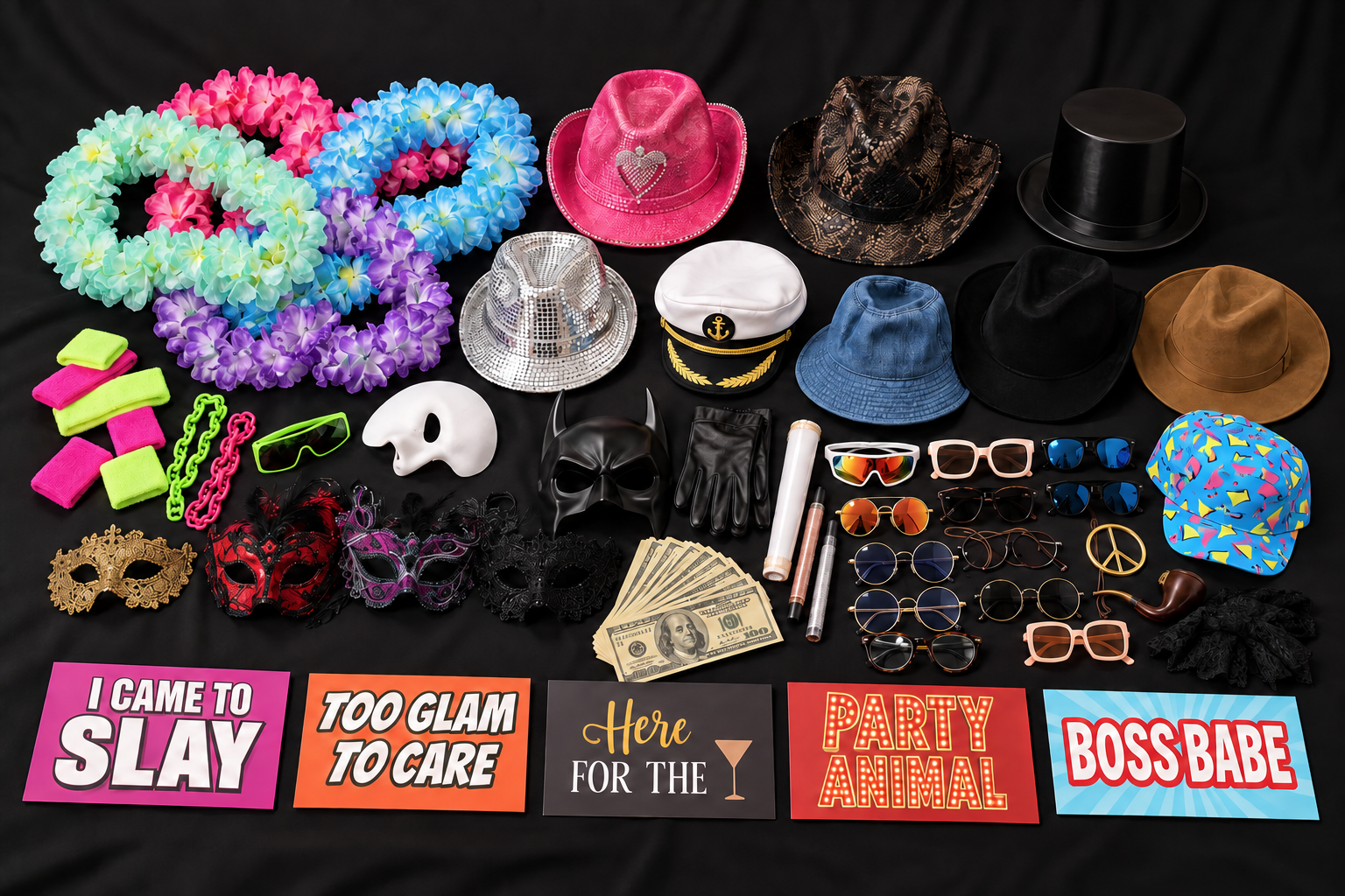 An assortment of included photo booth props: colorful leis, hats, glasses, masks and playful signs