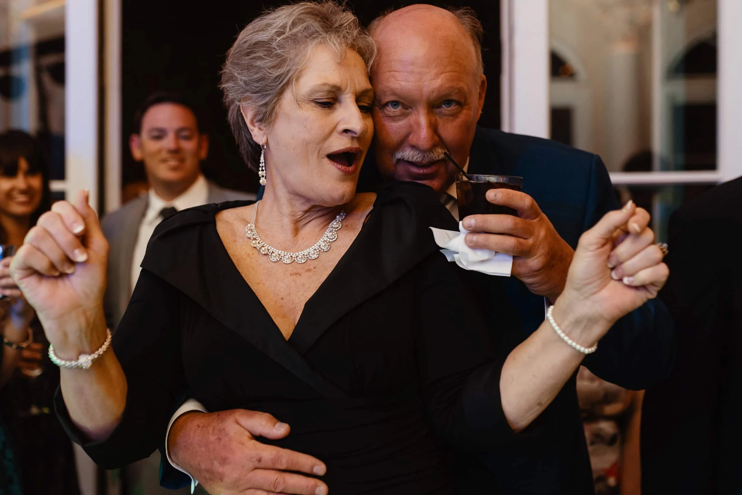 A couple dancing together at a wedding reception
