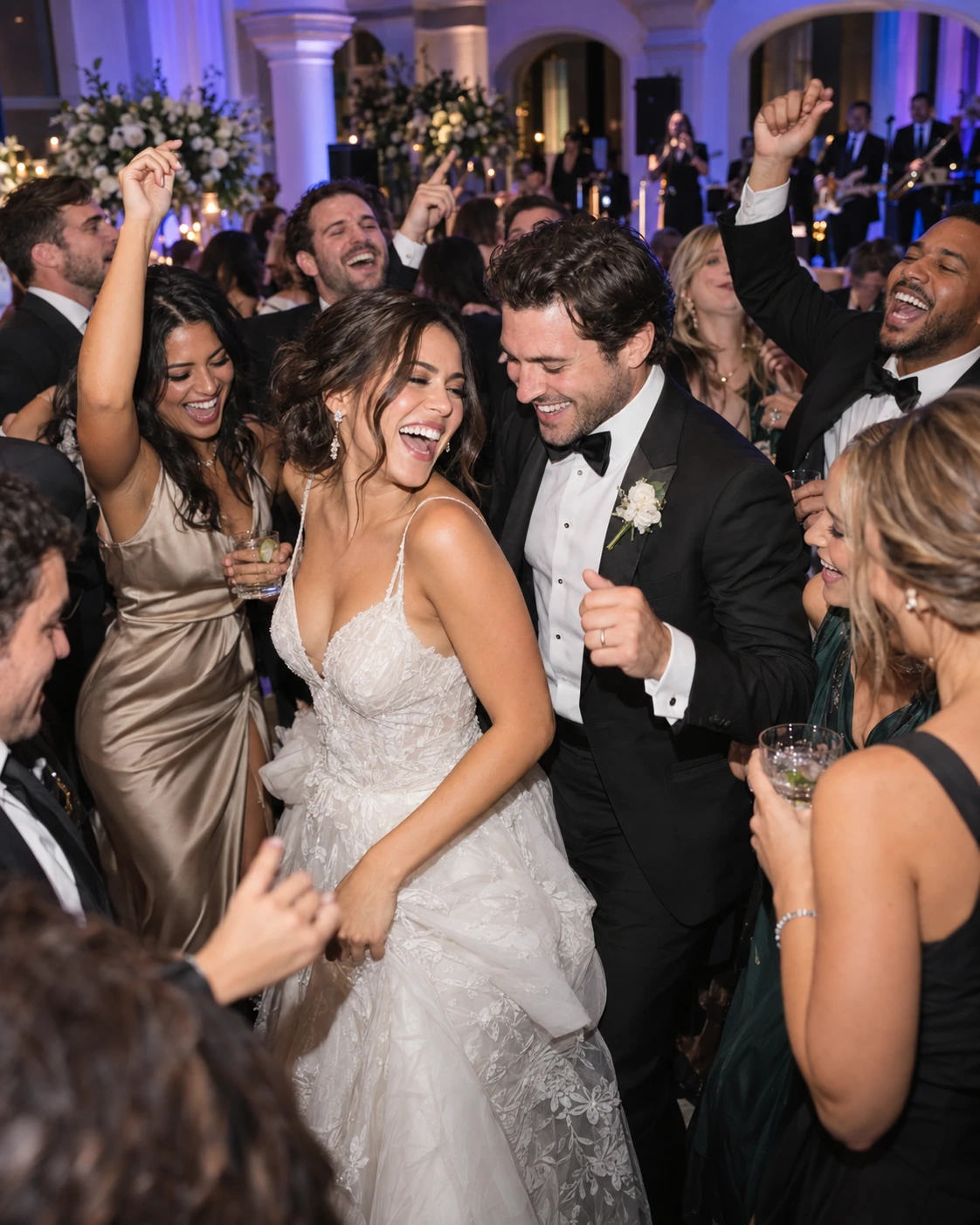 A vibrant wedding dance floor filled with joyful guests